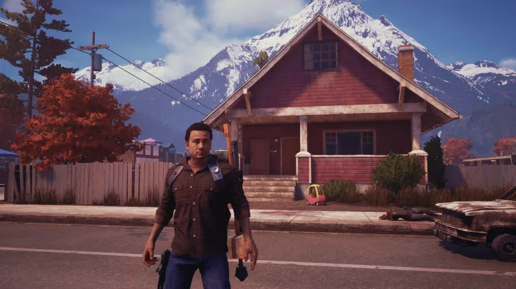 बाड़ से घिरा लाल घर